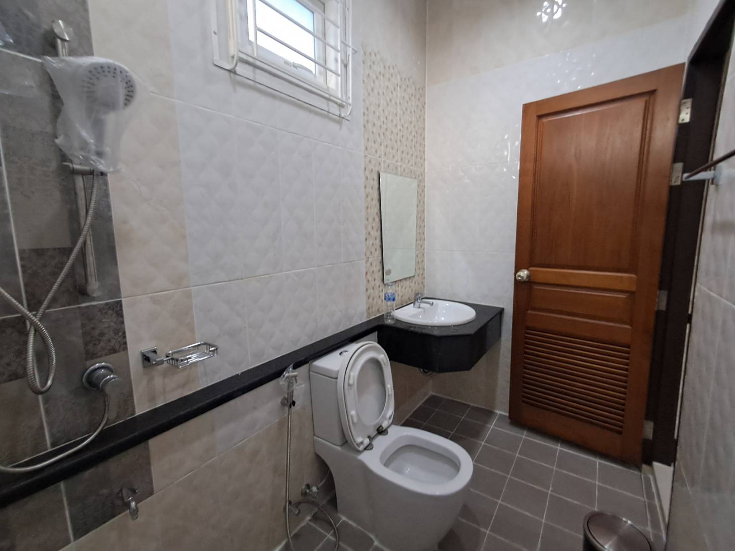 Bathroom with shower and water heater